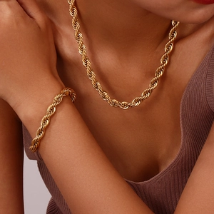 Fashionable 18K gold plated thick rope chain necklace and bracelet set on model