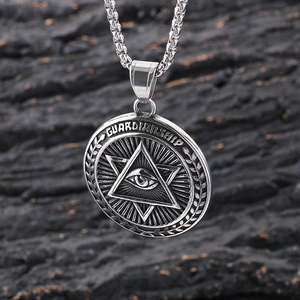 Punk silver Eye of Providence pendant necklace on dark rock background
