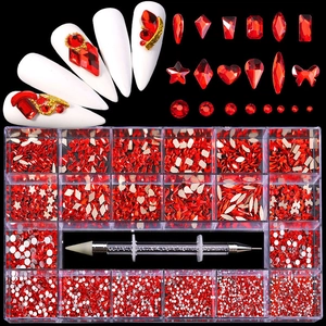 Macro detail of 21-compartment red crystal nail rhinestones set with dual-end dotting tool