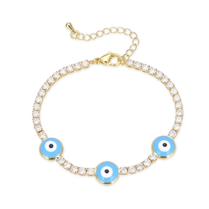 Gold tennis bracelet with sparkling zircons and blue evil eye charms on white background