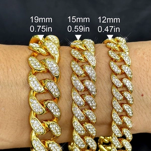 Three gold 12mm to 19mm Cuban link bracelets with rhinestones shown on a wrist