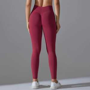 Detail showing high-waist scrunch butt design on dark red elastic yoga pants for fitness