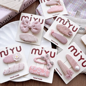 Pink fabric bow hair clips with pearls and lace on a white card for girls