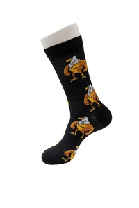 Detailed view of mid-calf socks with repeating cartoon muscle eagle patterns on black fabric