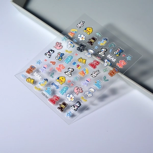 Detailed macro view of 5D embossed bear nail art stickers with 3D star and heart patterns