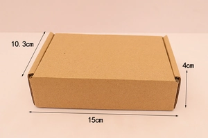 Brown corrugated cardboard mailing box with detailed dimensions of 15cm x 10.3cm x 4cm