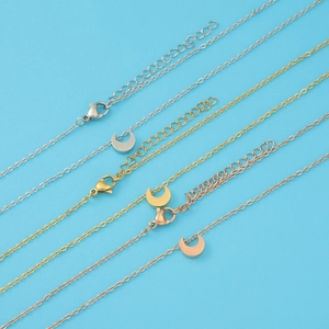 Detail of minimalist moon pendants on adjustable O-chains in gold, silver, and rose gold