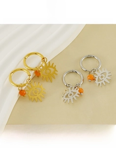 Detail of evil eye titanium steel earrings with orange beads in gold and silver finish
