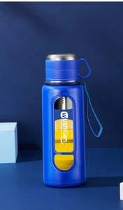Close-up of blue double-walled tea infuser bottle with built-in stainless steel filter