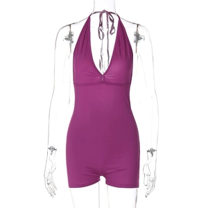 Detail of purple halter neck romper with sexy V-neck and ruched design on invisible model