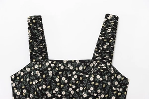 Detail of square neckline and ruched shoulder straps on floral print black dress