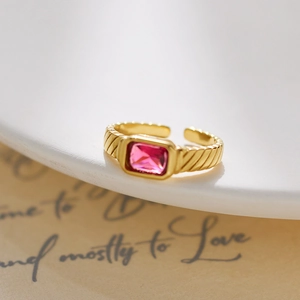 Detail of 18k gold plated adjustable ring with pink rectangular zircon and diagonal stripes