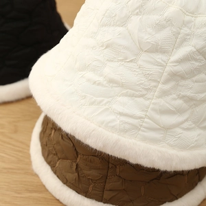 Detailed view of quilted winter bucket hats with thick faux fur lining in multiple colors