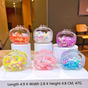 Detail of colorful snowflake quicksand charms in multiple pastel shades with dimensions
