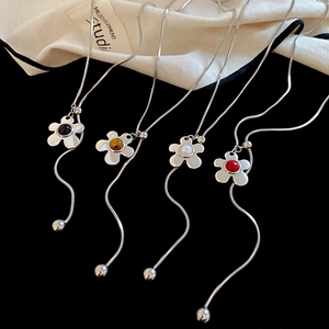 Silver flower pendant necklace with colorful pearls on a sleek snake chain design