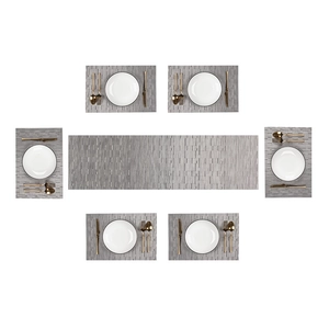 Detailed view of 7-piece grey PVC placemat and table runner set with woven bamboo texture