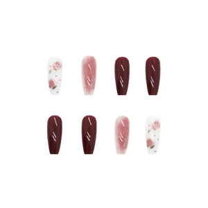 Long trapezoid press-on nails featuring rose floral patterns, marble wash, and burgundy gloss