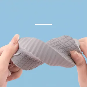Grey 3D bath sponge with fish-scale texture showing high elasticity and soft flexibility
