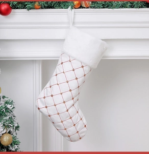 Close-up of white sequin Christmas stocking with diamond embroidery and faux fur trim
