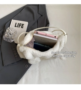 Interior view of white plush shoulder bag showing spacious main zipper compartment