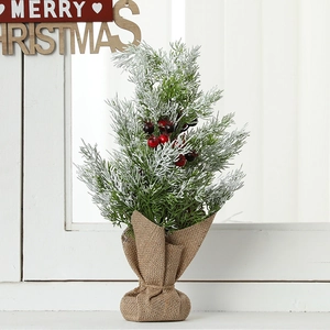 Mini frosted Christmas tree with berries and burlap base for tabletop holiday decor