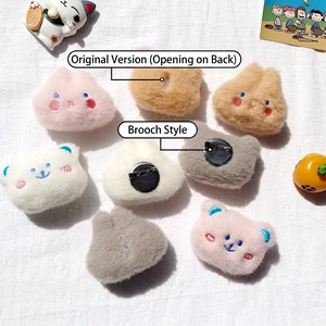 Cute cartoon plush animal brooches featuring blush bears and rabbits on textured fabric