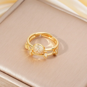 Elegant gold double-layer open ring featuring micro-pave zircons on a champagne box
