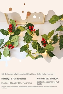 Detail of LED Holly Berry Garland with warm light, green leaves and battery box control