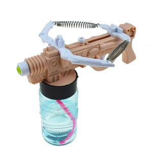 Novelty crossbow-shaped water and bubble gun toy with spring detail and liquid bottle