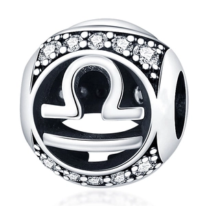 Detailed macro view of silver Libra zodiac bead charm with sparkling clear zircons