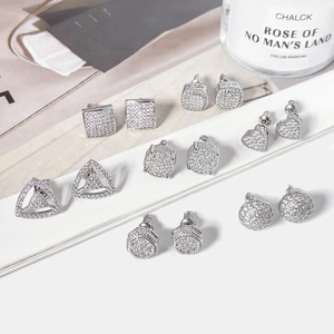 Silver geometric stud earrings set with pavé cubic zirconia in various shapes