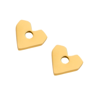 Close-up of polished gold heart-shaped metal earrings with smooth reflective surface
