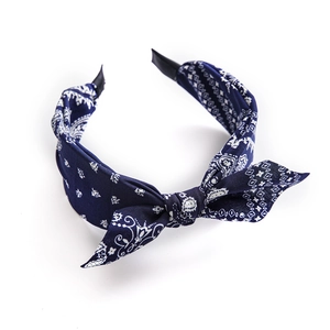 Navy blue paisley knot headband for women featuring white patterns and wide fabric design