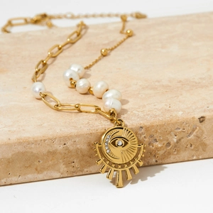 Handmade gold stainless steel necklace featuring natural pearls and eye of providence pendant