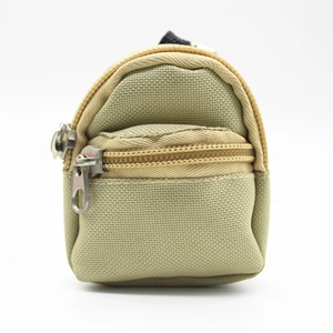 Close-up of khaki mini backpack coin purse with double silver zippers and top handle