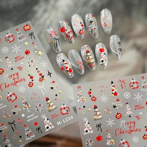 Stickers à ongles de Noël avec pomme, sapin et nœud pour une manucure festive élégante