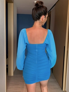 Detailed back view of a slim-fit blue mesh dress featuring ruched texture and a hidden zipper