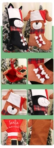 Detail of plush Christmas stockings with cat and dog designs and checkered scarves