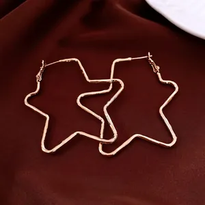 Chic rose gold pentagon star hoop earrings displayed on premium brown silk background