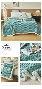 Detail of lake green heavy velvet blanket with premium embossed grid texture and stitched edges