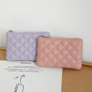 Quilted PU leather coin purse for women featuring top metal zipper in pink and purple