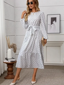 Elegant white long sleeve dress with leaf print, waist tie and ruffled hem details