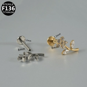 Detailed view of flower titanium labret stud with zircon stones, 1.2mm gauge size