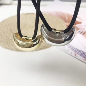 Minimalist moon-shaped metal hair ties in gold and silver finish with elastic bands