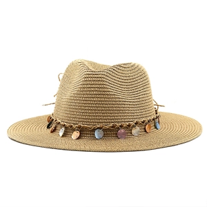 Close-up of woven straw hat featuring a decorative cord and colorful shell charms
