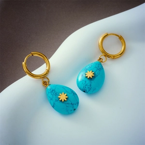 Retro titanium steel gold earrings with turquoise water drop pendants in a sleek design
