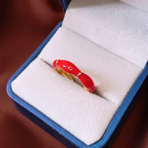Minimalist oval red enamel ring with golden G logo in 14K gold plated finish