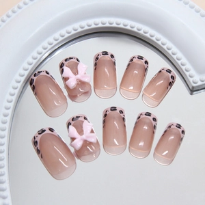 Pink leopard print press-on nails with 3D resin bows in medium long square shape
