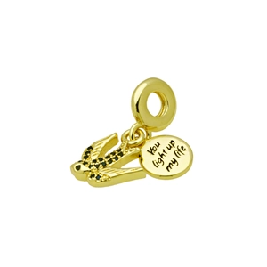 Detailed view of golden swallow charm with black gem and 'You light up my life' engraving