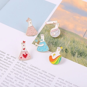 Creative chemistry lab enamel pin set featuring colorful flasks, heart and rainbow elements